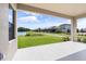 Covered patio overlooking a pond and community landscape at 12854 Boggy Creek Dr, Riverview, FL 33579