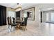 Elegant dining room with gold and black accents, glass-top table, and six chairs at 12854 Boggy Creek Dr, Riverview, FL 33579
