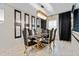Formal dining room with glass-top table and gold chairs at 12854 Boggy Creek Dr, Riverview, FL 33579
