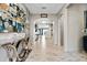 Elegant entryway with tile floors and a modern console table at 12854 Boggy Creek Dr, Riverview, FL 33579