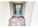 Double front doors with glass inserts and brick flooring at 12854 Boggy Creek Dr, Riverview, FL 33579