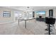Game room features a pool table, bar stools, and a large TV at 12854 Boggy Creek Dr, Riverview, FL 33579