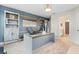 Home office with desk, seating, and built-in shelving at 12854 Boggy Creek Dr, Riverview, FL 33579