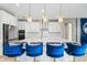 Modern kitchen with white cabinets, quartz countertops, and stainless steel appliances at 12854 Boggy Creek Dr, Riverview, FL 33579