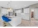 Modern kitchen with white cabinets, quartz countertops, and stainless steel appliances at 12854 Boggy Creek Dr, Riverview, FL 33579