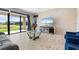 Bright living room with sliding glass doors and a view of the backyard at 12854 Boggy Creek Dr, Riverview, FL 33579