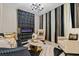 Living room with black velvet sofa, gold accents, and electric fireplace at 12854 Boggy Creek Dr, Riverview, FL 33579