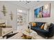 Living area features a black velvet sofa and gold accents at 12854 Boggy Creek Dr, Riverview, FL 33579