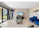 Living room with sliding doors to backyard and a fireplace at 12854 Boggy Creek Dr, Riverview, FL 33579