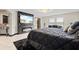 Main bedroom featuring a fireplace and large TV at 12854 Boggy Creek Dr, Riverview, FL 33579