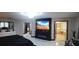 Luxurious main bedroom featuring a fireplace, large TV, and ensuite bath at 12854 Boggy Creek Dr, Riverview, FL 33579