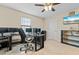 Home office with a large desk and multiple monitors at 12854 Boggy Creek Dr, Riverview, FL 33579