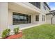 Private patio with sliding glass doors and lake view at 12854 Boggy Creek Dr, Riverview, FL 33579