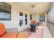 Screened balcony with firepit and lake view at 12854 Boggy Creek Dr, Riverview, FL 33579