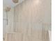 Large walk-in shower with built-in seat and rainfall shower head at 12854 Boggy Creek Dr, Riverview, FL 33579