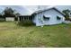 Side view of house showcasing sunroom addition at 1355 Devonshire N Dr, St Petersburg, FL 33710