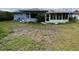 Back of house with a large backyard at 1355 Devonshire N Dr, St Petersburg, FL 33710