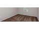 Empty bedroom with brown carpet, white trim, and a window with blinds at 14729 Summer Branch Dr, Lithia, FL 33547