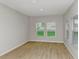 Bright living room with light gray walls and wood-look flooring at 14729 Summer Branch Dr, Lithia, FL 33547