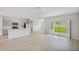 Open concept living area with kitchen and backyard view at 14729 Summer Branch Dr, Lithia, FL 33547