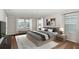Bright main bedroom with large windows and neutral decor at 14729 Summer Branch Dr, Lithia, FL 33547