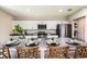 Modern kitchen with white cabinets, stainless steel appliances, and an island with seating at 14733 Summer Branch Dr, Lithia, FL 33547