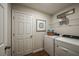 Laundry room with washer, dryer, and shelving for storage at 14741 Summer Branch Dr, Lithia, FL 33547