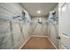 Spacious walk-in closet with wire shelving and hanging rods at 14741 Summer Branch Dr, Lithia, FL 33547