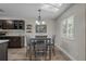 Kitchen dining area with table and chairs, and a view to the backyard at 1626 Spottswood Cir, Palm Harbor, FL 34683