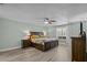 Spacious main bedroom with a king-size bed and wood furniture at 1626 Spottswood Cir, Palm Harbor, FL 34683