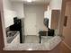 Modern kitchen with granite countertops and stainless steel appliances at 18001 Richmond Place Dr # 125, Tampa, FL 33647