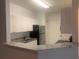 Modern kitchen with granite countertops and stainless steel appliances at 18001 Richmond Place Dr # 125, Tampa, FL 33647