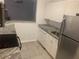 Cozy kitchen features stainless steel appliances, granite countertops, and modern fixtures at 18001 Richmond Place Dr # 125, Tampa, FL 33647