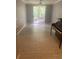 Bright living room features hard surface floors and sliding glass doors to the balcony at 18001 Richmond Place Dr # 125, Tampa, FL 33647