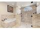 Spa-like bathroom with soaking tub and walk-in shower at 18321 Citation St, Lutz, FL 33549