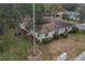 Aerial view of single-story home with surrounding lawn at 2035 Hampstead Cir # 275, Sun City Center, FL 33573