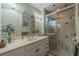 Bathroom with shower, vanity, and linen storage at 2035 Hampstead Cir # 275, Sun City Center, FL 33573