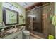 Bathroom with marble vanity and large shower at 2035 Hampstead Cir # 275, Sun City Center, FL 33573