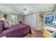 Comfortable bedroom with a queen-size bed and an ensuite bathroom at 2035 Hampstead Cir # 275, Sun City Center, FL 33573