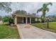 Front view of single-story home with carport and landscaping at 2035 Hampstead Cir # 275, Sun City Center, FL 33573
