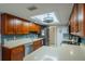 L-shaped kitchen with ample counter space and cabinets at 2035 Hampstead Cir # 275, Sun City Center, FL 33573
