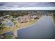 Wide shot of lakefront community with various homes at 2420 Allegheny Valley St, Ruskin, FL 33570