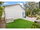 Landscaped backyard with artificial turf and a detached garage at 2710 3Rd S Ave, St Petersburg, FL 33712