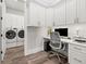 Laundry room with desk and built-in cabinetry at 2710 3Rd S Ave, St Petersburg, FL 33712