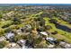 Wide aerial showcasing home's location near golf course at 2781 Westchester Dr S, Clearwater, FL 33761