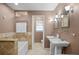 Elegant bathroom with double vanity, soaking tub, and separate shower at 2781 Westchester Dr S, Clearwater, FL 33761
