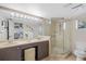 Bathroom with double vanity, shower and tile flooring at 2781 Westchester Dr S, Clearwater, FL 33761