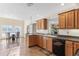 Spacious kitchen with island, wood cabinets, and granite countertops at 2781 Westchester Dr S, Clearwater, FL 33761