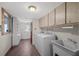 Laundry room with washer, dryer, and utility sink at 2781 Westchester Dr S, Clearwater, FL 33761