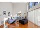 Spacious living room with hardwood floors and large windows at 2781 Westchester Dr S, Clearwater, FL 33761